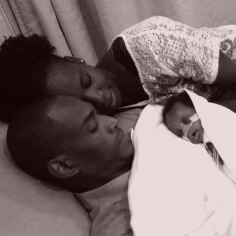 Photo of family holding newborn baby